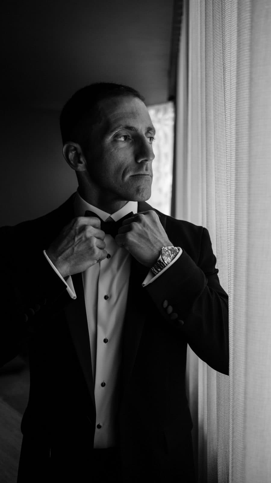 Black and white portrait of Chris in his tuxedo