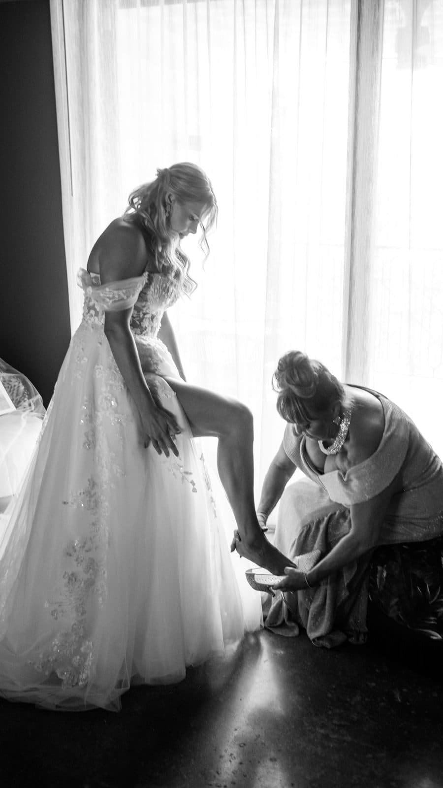 Alyssa walking outdoors in her gown and veil