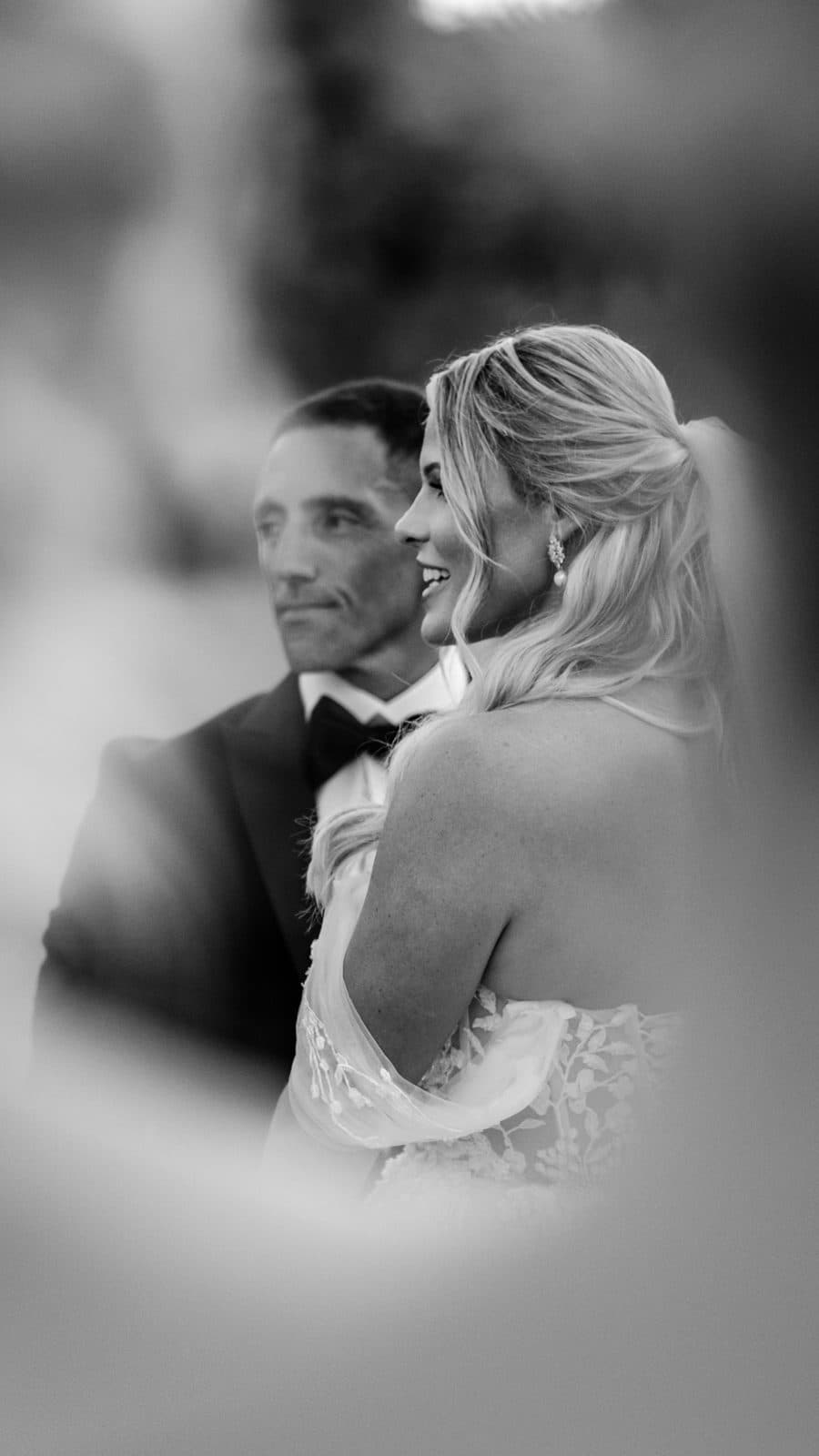 Black and white portrait of Alyssa and Chris kissing