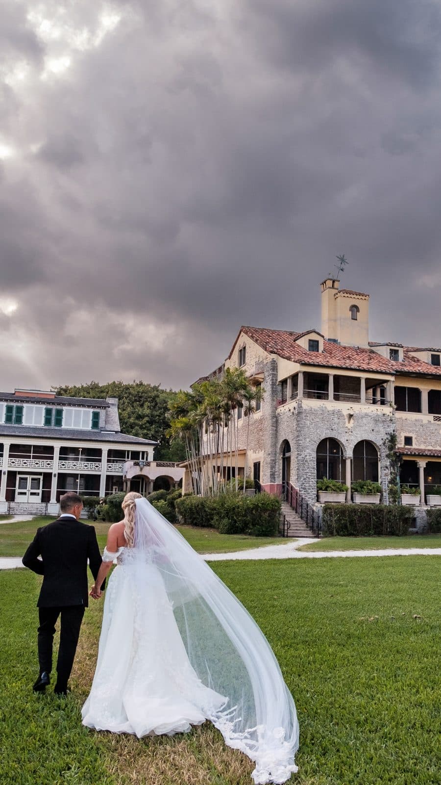 Alyssa and Chris walking through the reception