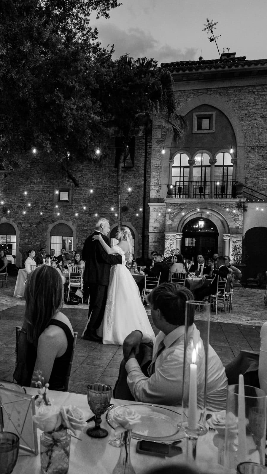 Alyssa and Chris kissing under the tent