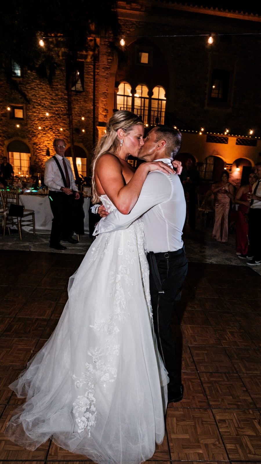 Alyssa and Chris on the dance floor with guests around them