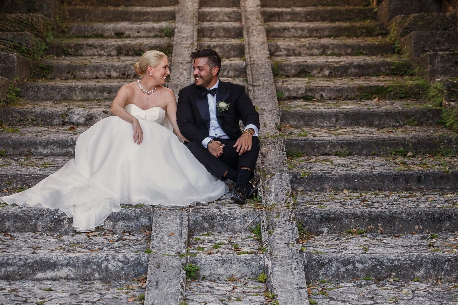Amy and Chris on the grounds with the mansion nearby