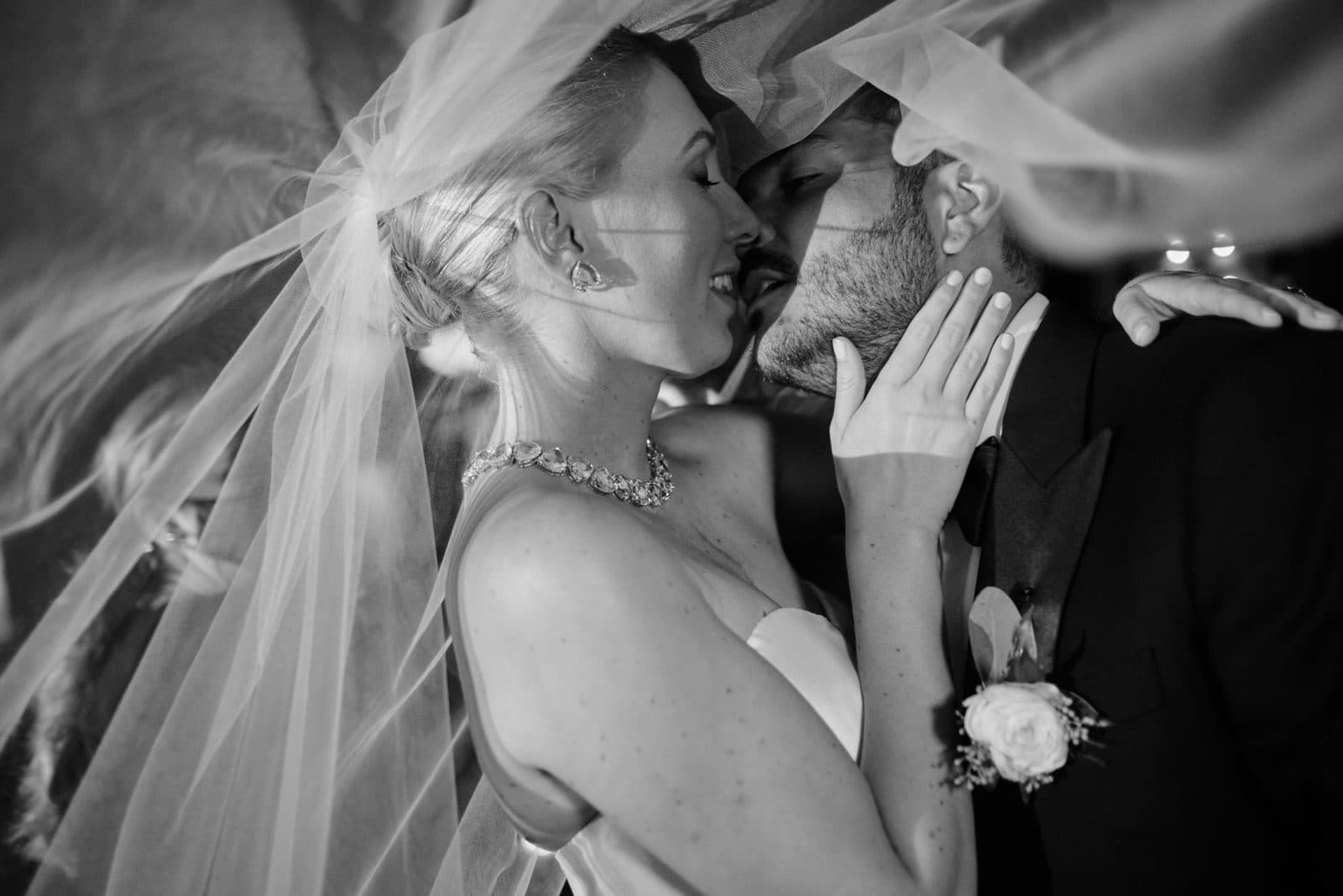 A black and white photograph of Amy and Chris outdoors