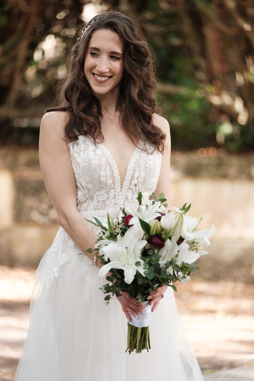 Chloe and Michael standing together with her bouquet
