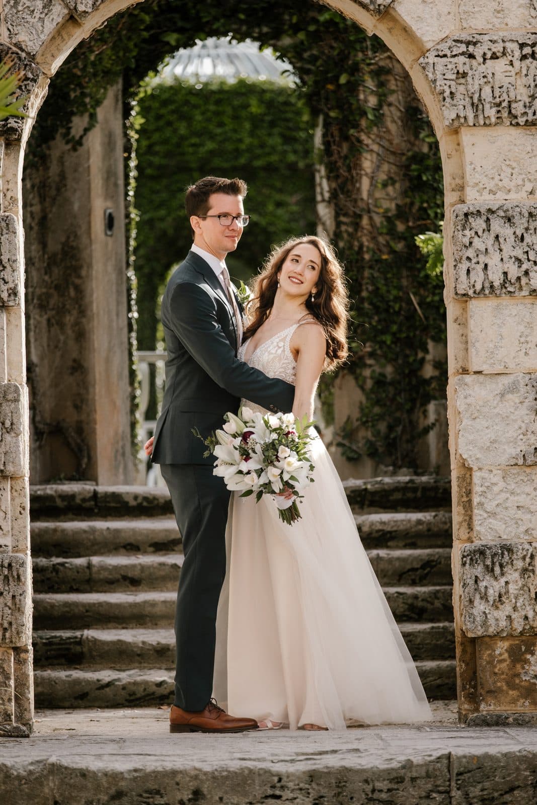 Chloe and Michael laughing in front of an arch