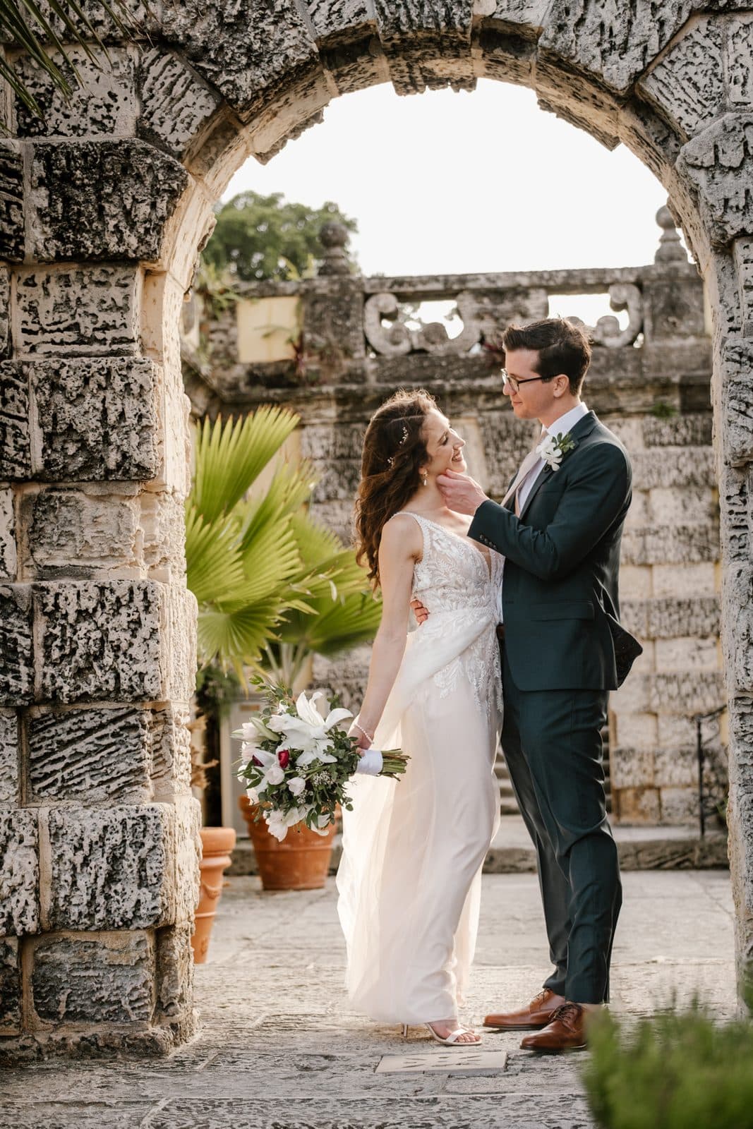 Chloe and Michael walking away through the colonnade