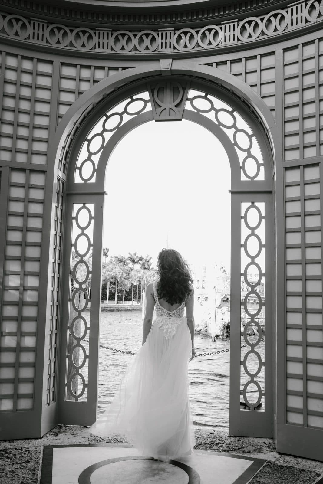 Chloe and Michael walking toward the camera through an arch