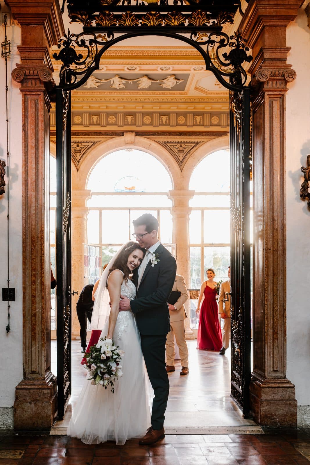 A portrait of Chloe and Michael in the arches