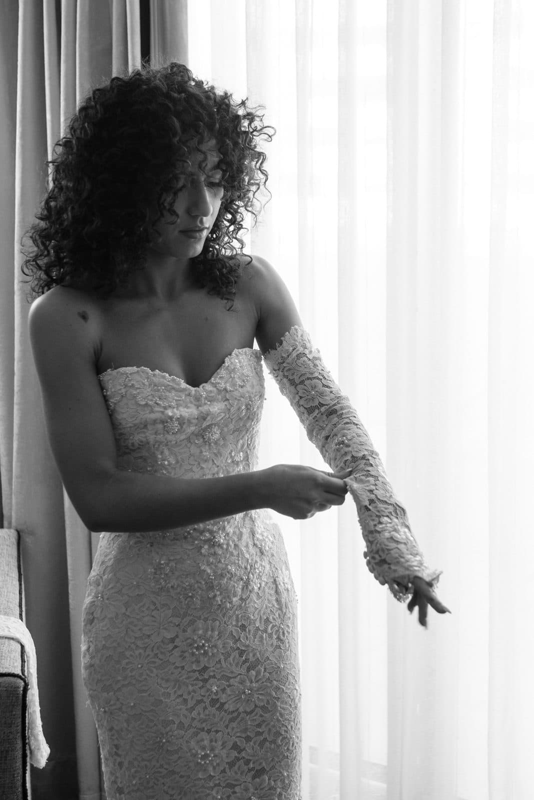 Sophia in her strapless gown, looking down