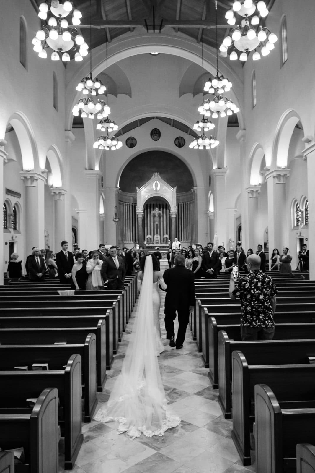 Sophia and Patrick kissing, her veil caught around them