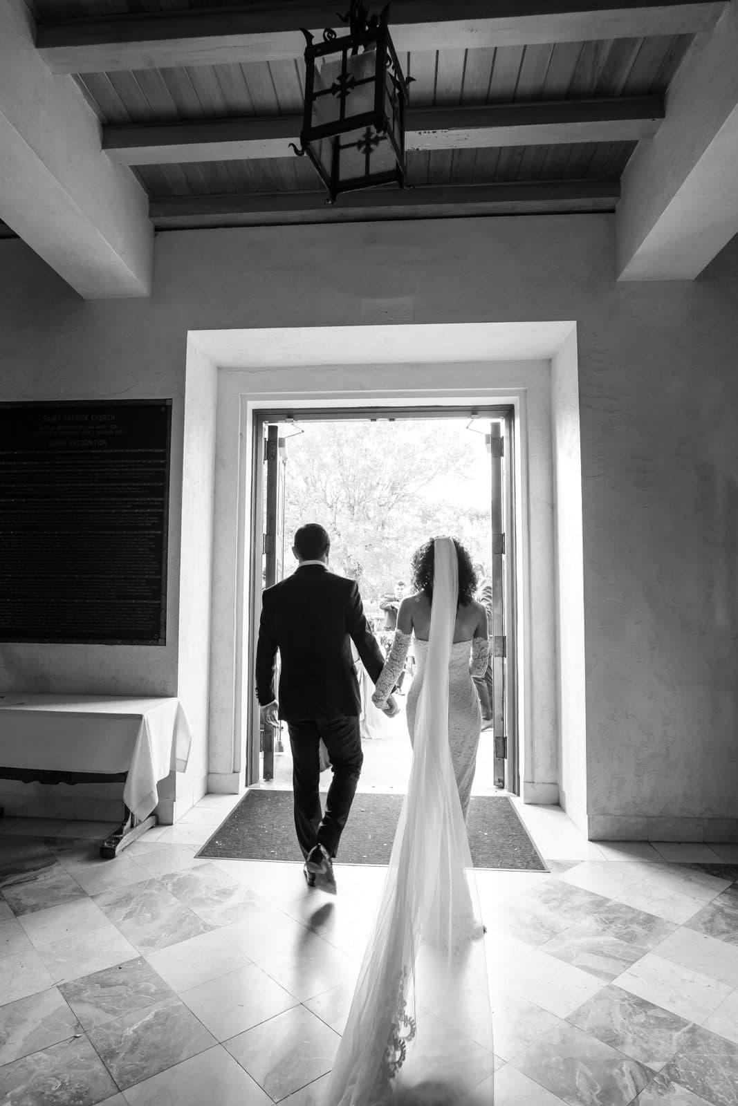 Black and white photograph of the ceremony inside St. Patrick Catholic Church